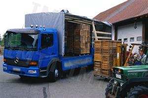 Num automóvel pesado de mercadorias de dois eixos, concentrar a carga transportada no limite traseiro da caixa de carga: